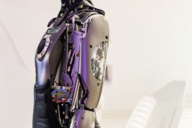 debate over whether AI can replace CEOs, robot and executive in boardroom